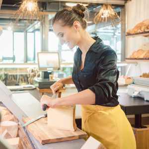 Woman cutting cheese