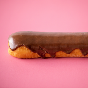 Long john donut in pink background